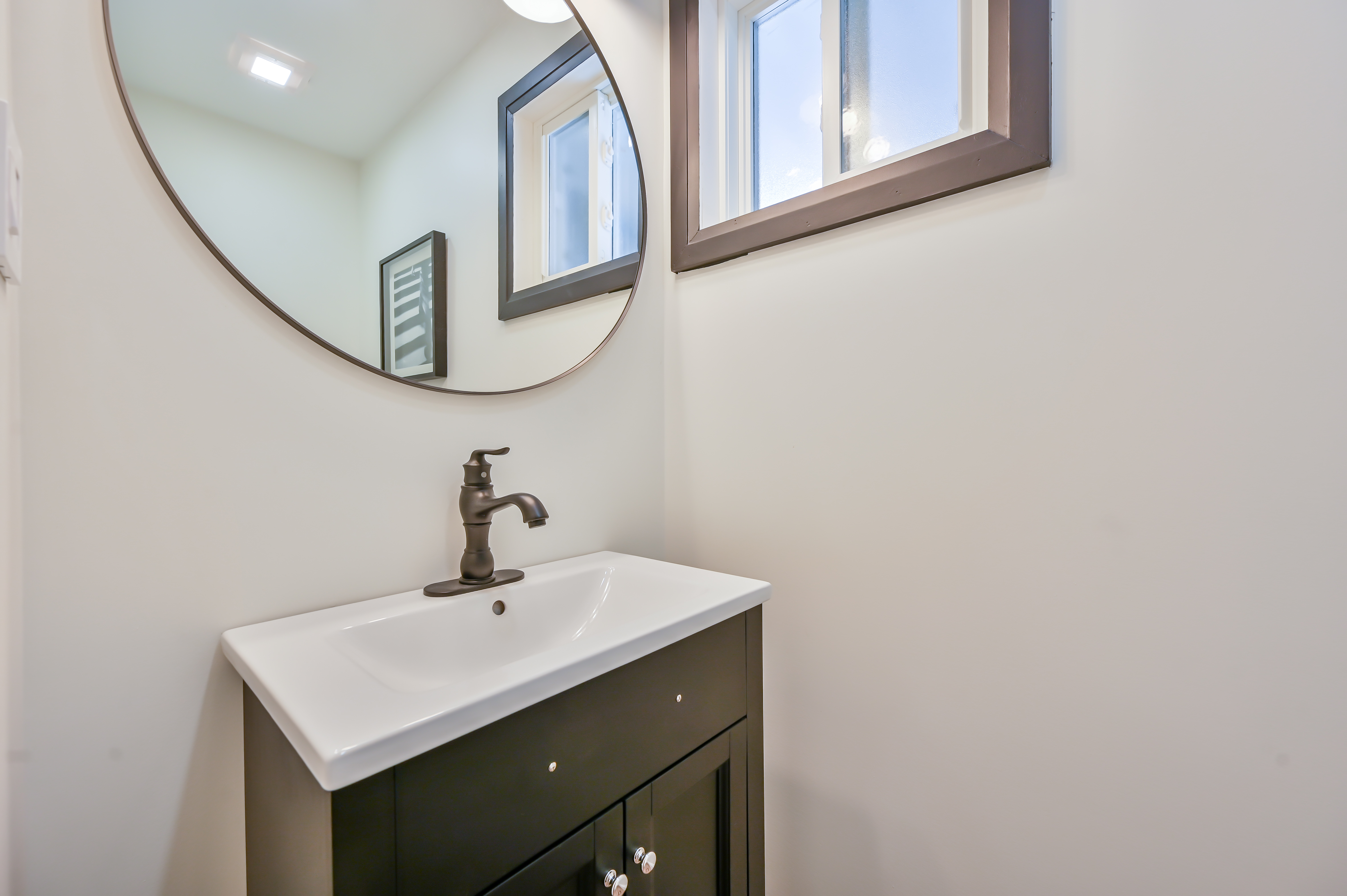 Clean finished powder room with good natural light and modern fixtures — solid portfolio piece — Kron, Hamilton | MTC Renovations